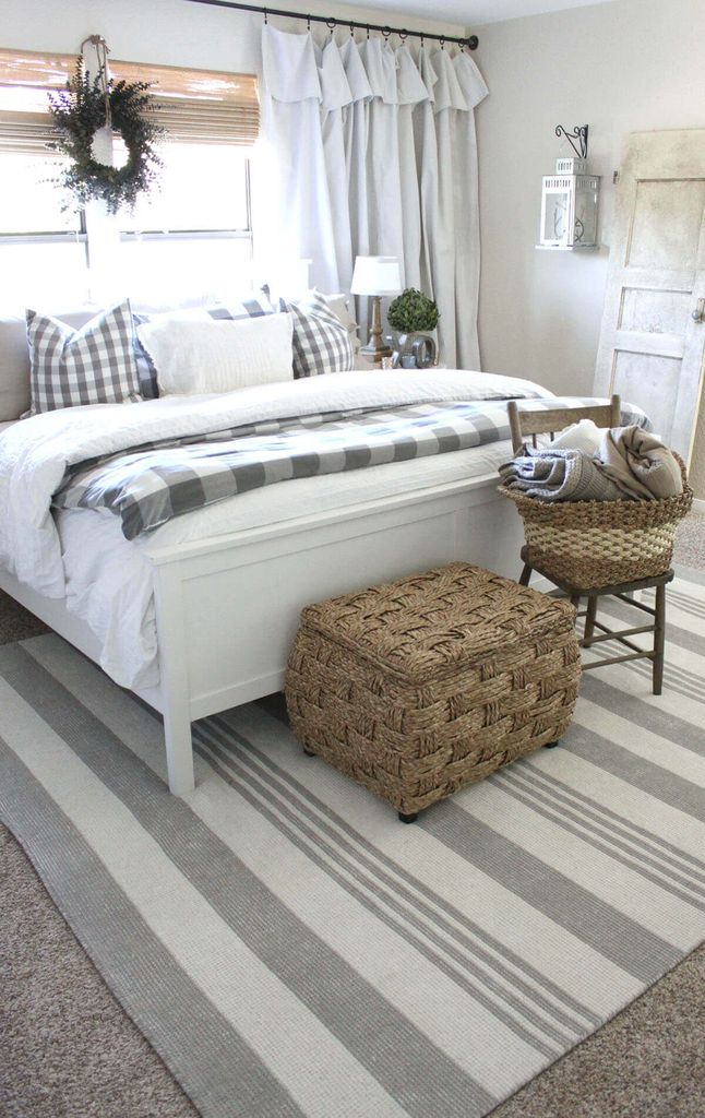 Striped rug combined with white bed and rattan basket