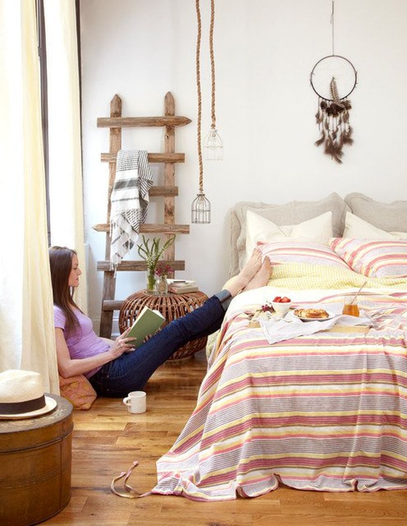 Stunning-bohemian-bedroom-with-features-eclectic-colors-and-patterns-throughout-the-whole-bedroom-and-adding-a-unique-night-stand-to-store-houseplant