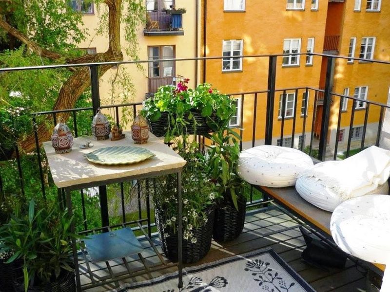 Unique-balcony-garden-with-herb-and-corner-home-lawn-elegant-interesting-classic-bench-and-a-small-table.