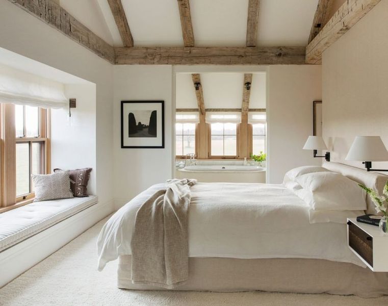 Weathered-wood-ceiling-beams-neutral-textiles-and-much-natural-light.-1