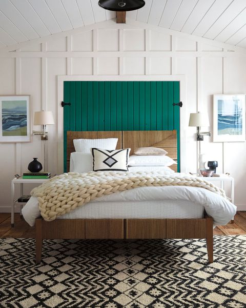 White-wooden-panels-a-bright-emerald-headboard-a-printed-rug.-1