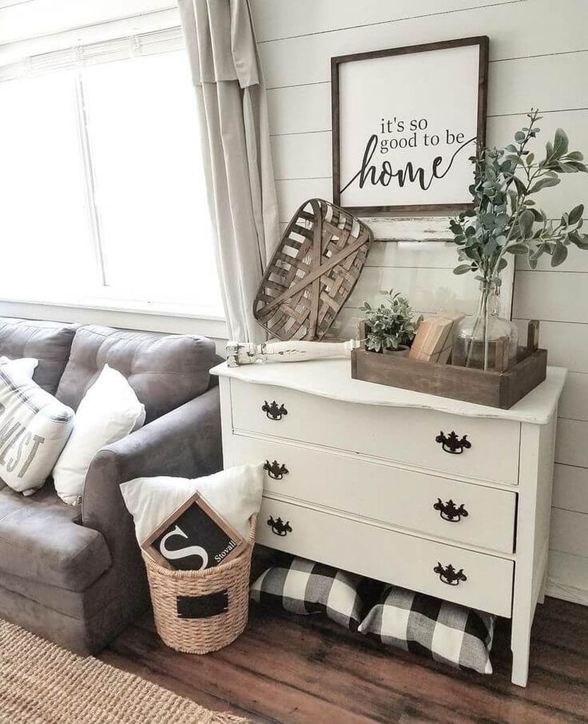 White wooden walls combined with drak grey sofa