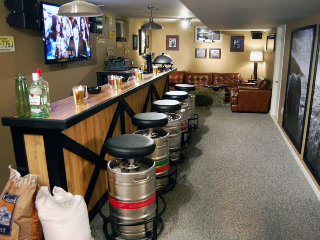 Wooden coffee bar combined with a korsi from a white iron barrel and a television set as decoration