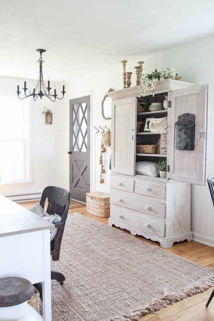 Wooden cupboard in grey combined with wooden floor