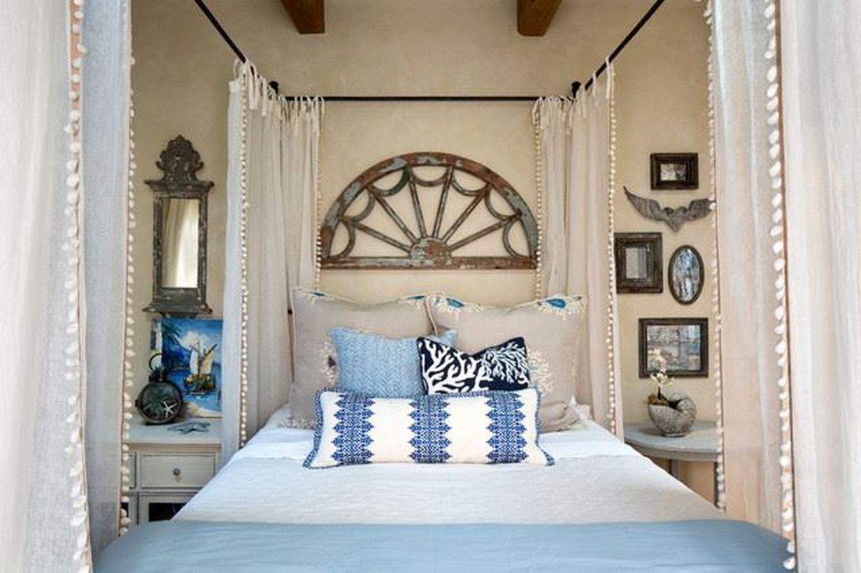 A-simple-bed-with-a-boho-touch-you-can-add-a-white-mosquito-net-to-the-iron-frame-of-your-bed-to-make-you-comfortable-while-sleeping