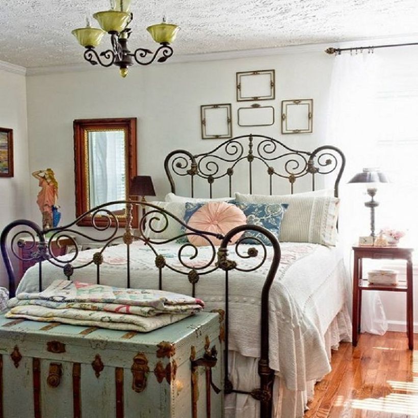 Classic-black-iron-bed-frame-that-creates-a-vintage-bedroom-atmosphere-by-adding-nightstand-to-store-table-lamp-furniture