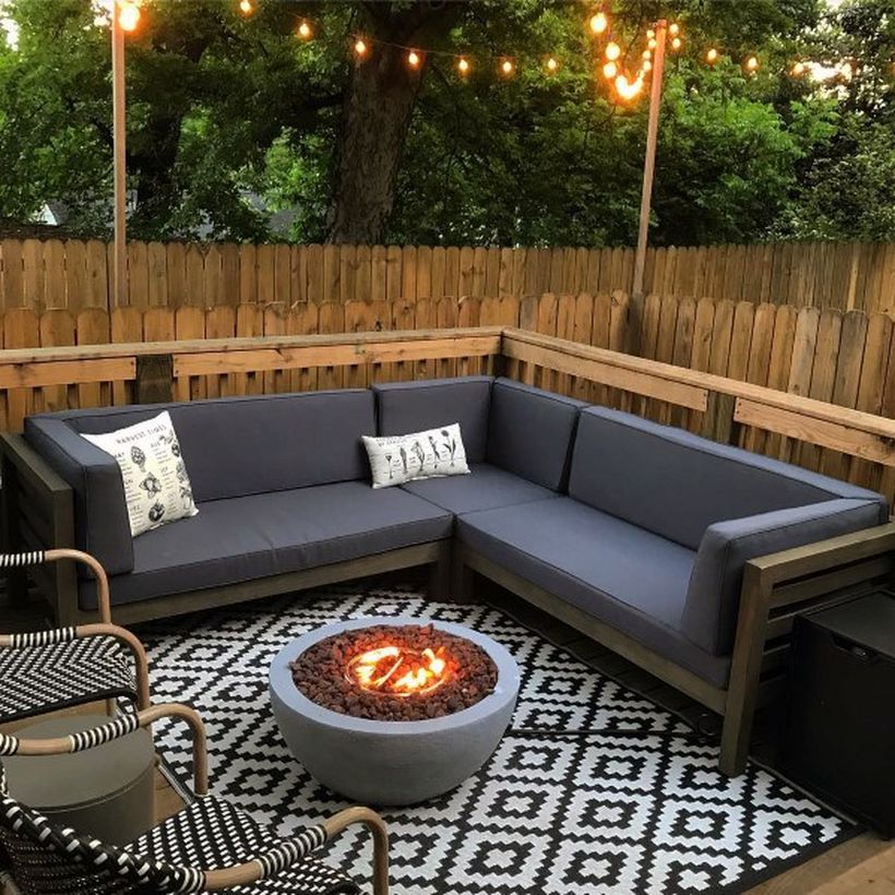 Cool-deck-fire-pit-patio-design-with-chair-rattan-and-black-and-white-rug-for-your-inspiration