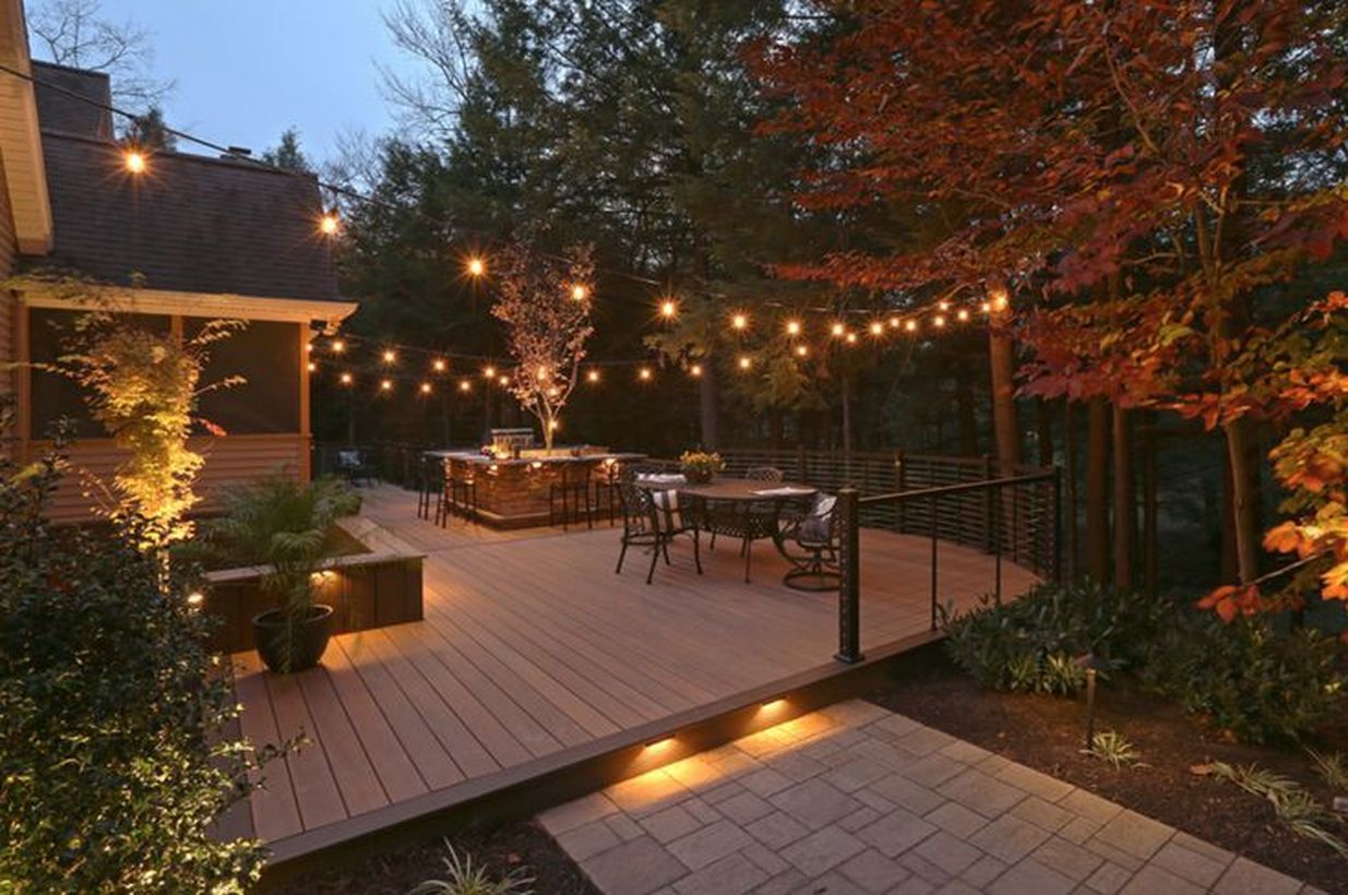 Decorative-lighting-on-your-backyard-patio-deck-by-extending-light-bulbs-to-get-good-lighting-and-feel-serene-at-night