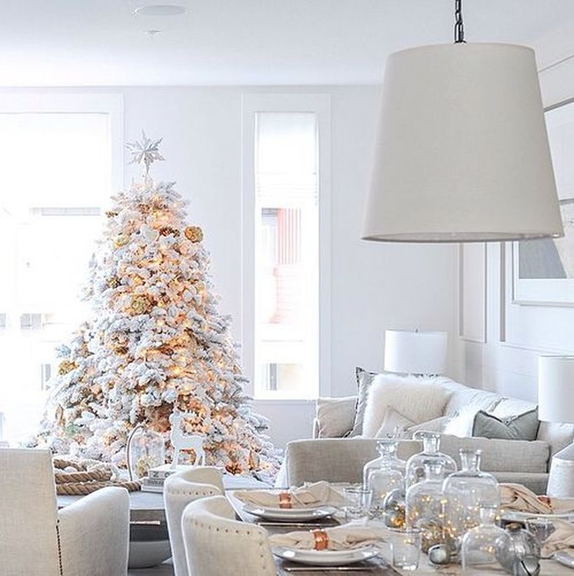 Glam-white-christmas-tree-with-decorative-lighting-and-gold-bell-ornament-for-decoration-your-living-room