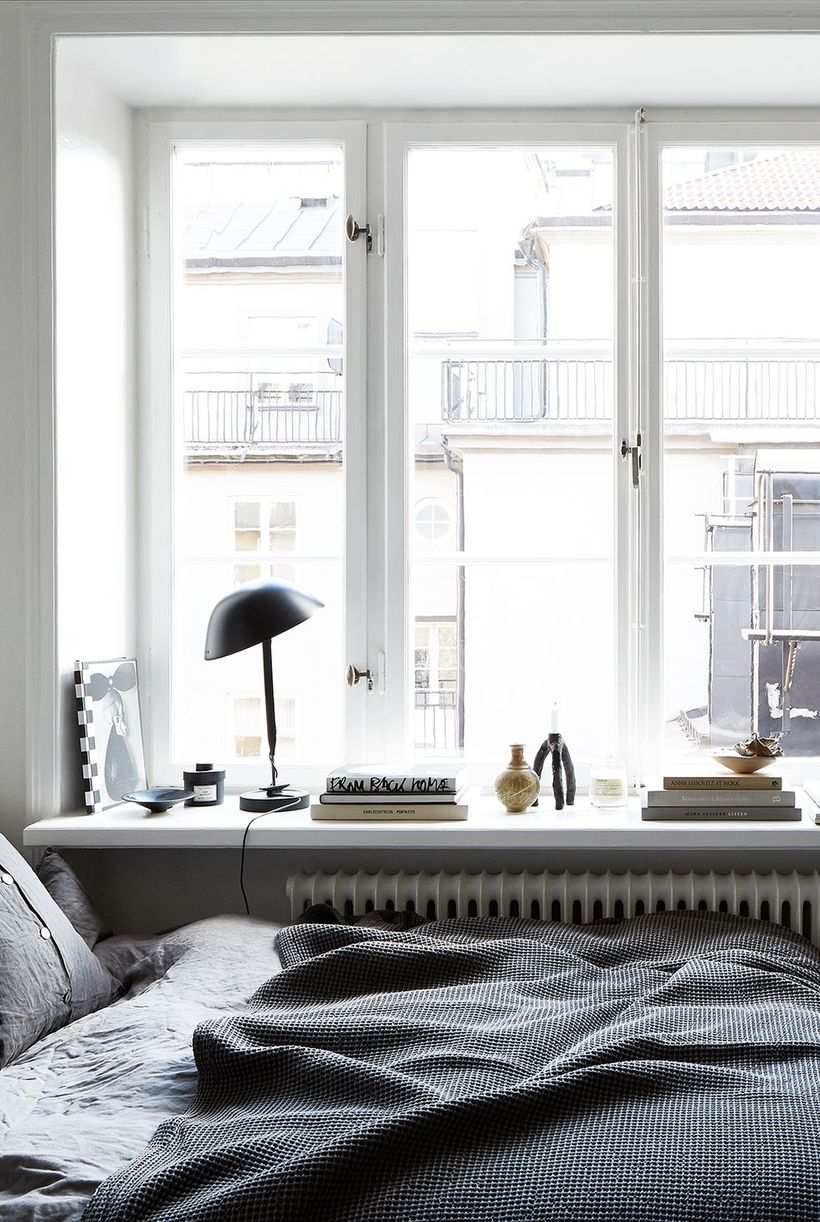 Gray-bedroom-and-minimalist-office-desk-that-becomes-one-with-your-bed-in-front-of-the-window-so-you-can-get-fresh-light-in-the-morning