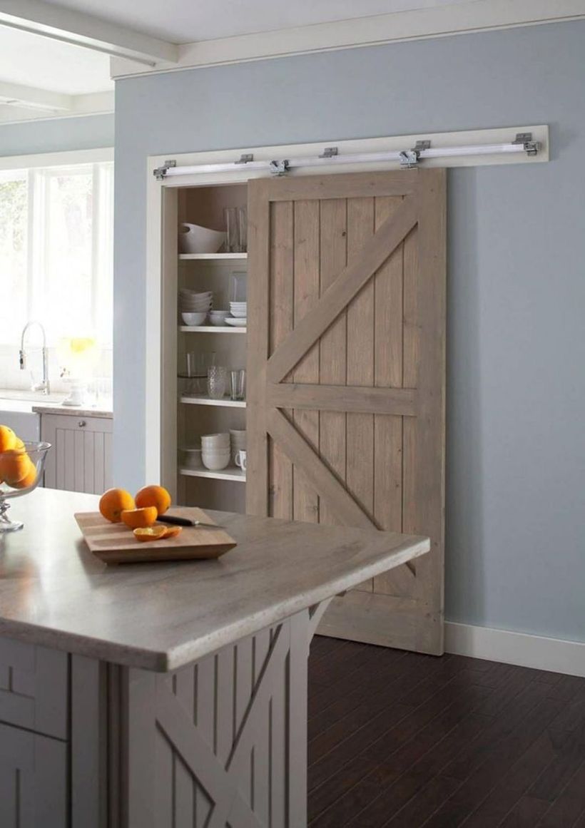 Gray-wooden-kitchen-island-and-wooden-sliding-door-for-tiered-shelves
