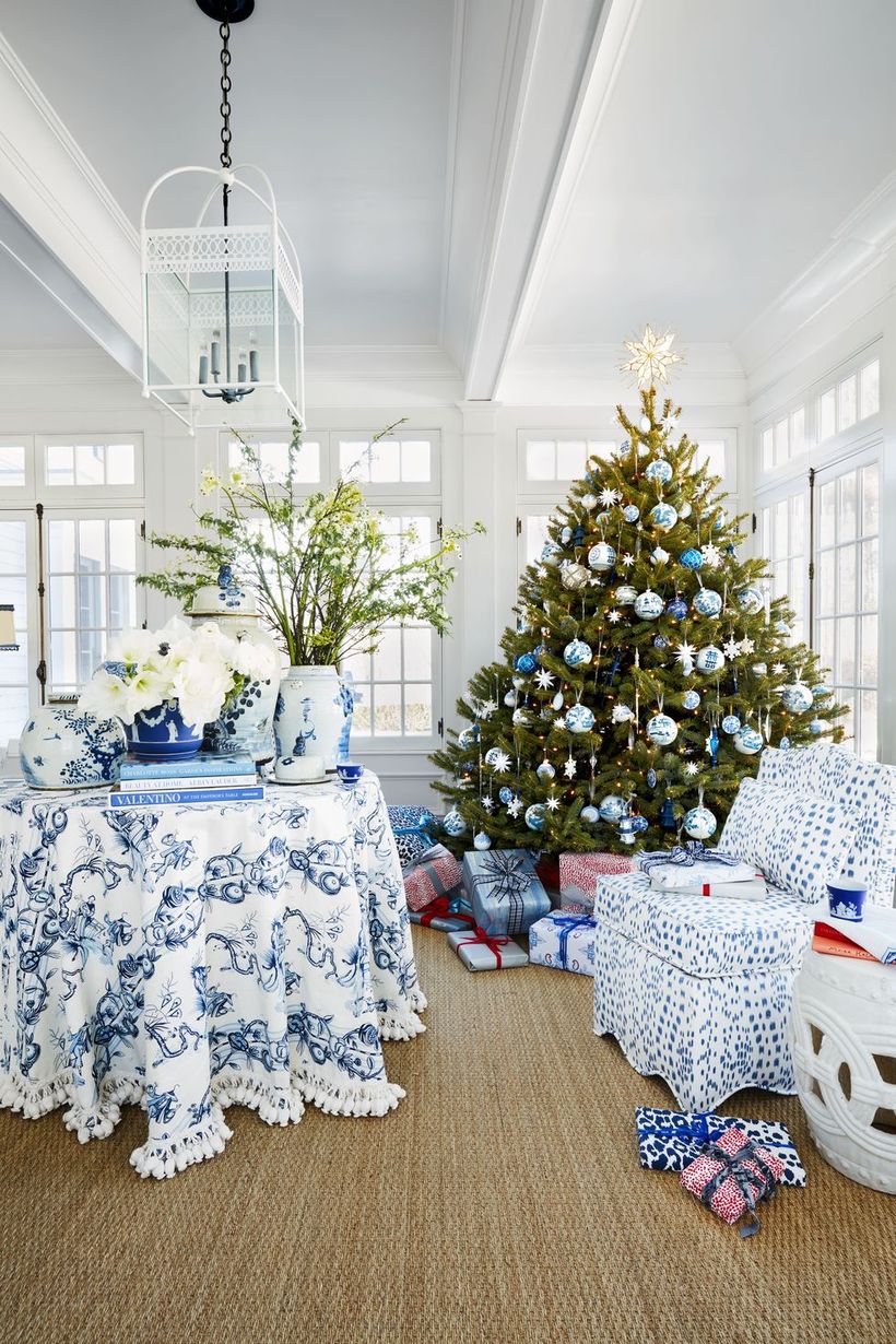 Green-christmas-tree-with-unique-bell-ornament-pattern-small-snow-ornament-and-star-ornament-at-the-top-to-make-it-more-attractive-for-living-room-decoration