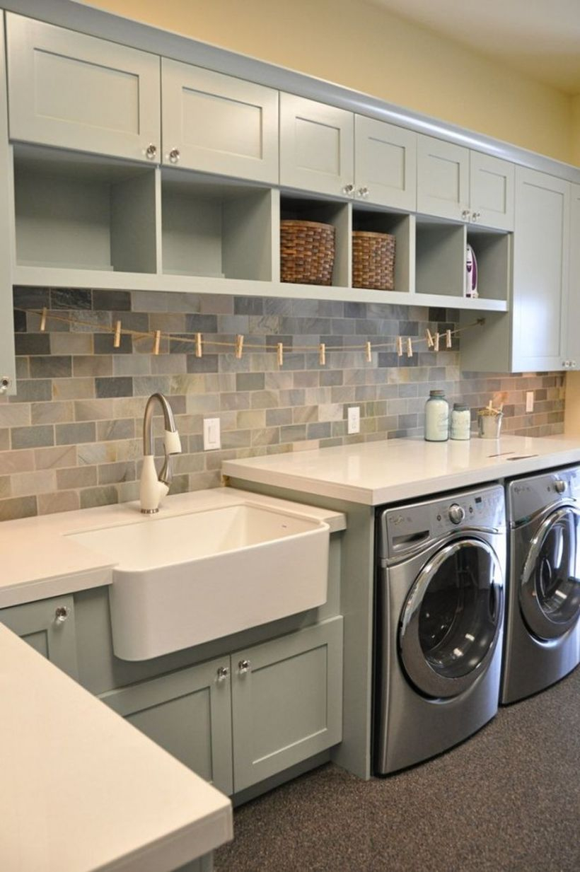 Laundry room with gray cabinet and white sink