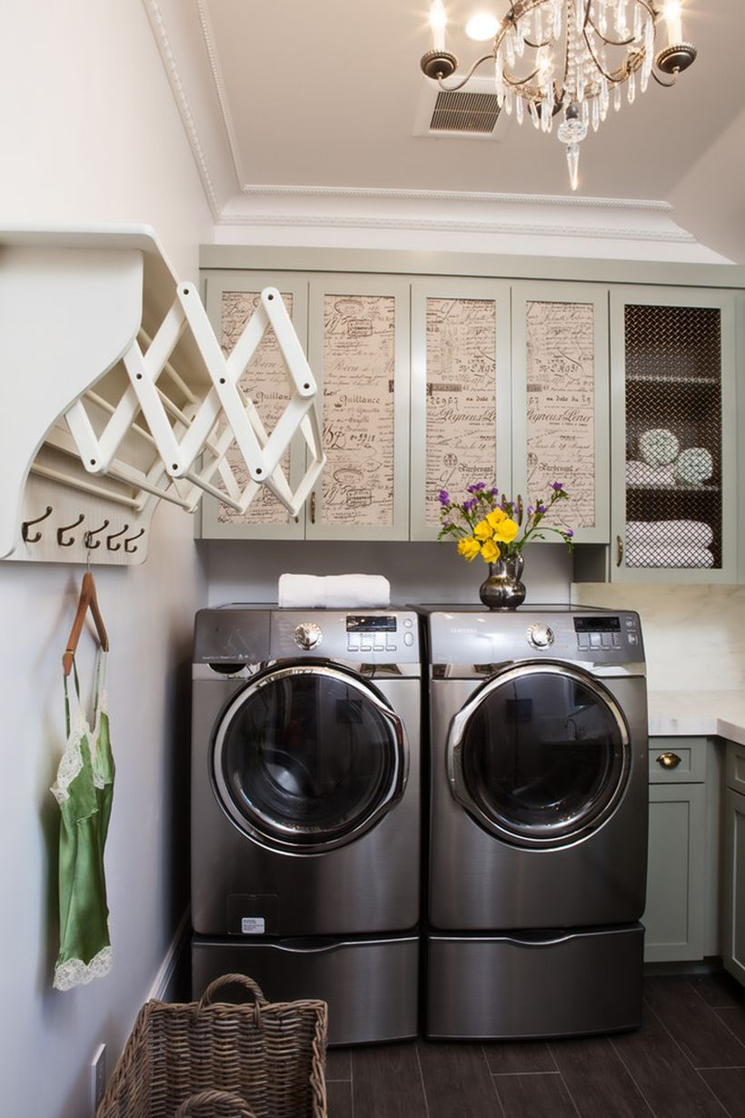 Laundry room with unique cabinet, white walls and wooden hanger