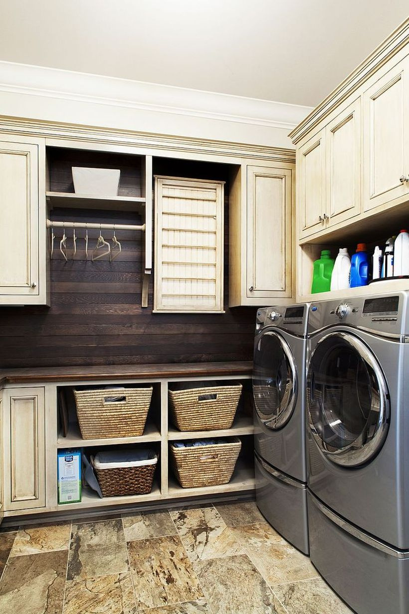 Laundry room wiyh white cabinet and gray washing machine