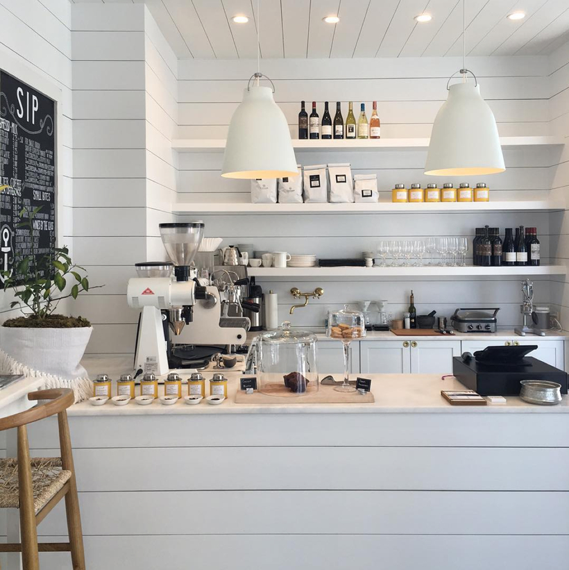 Marble-texture-background-white-home-accessories-decor-bright-coffee-shop-retail-store-in-florida-called-outpost-modern-interior-floor-design-shiplap-wall-faux-decoration-pieces