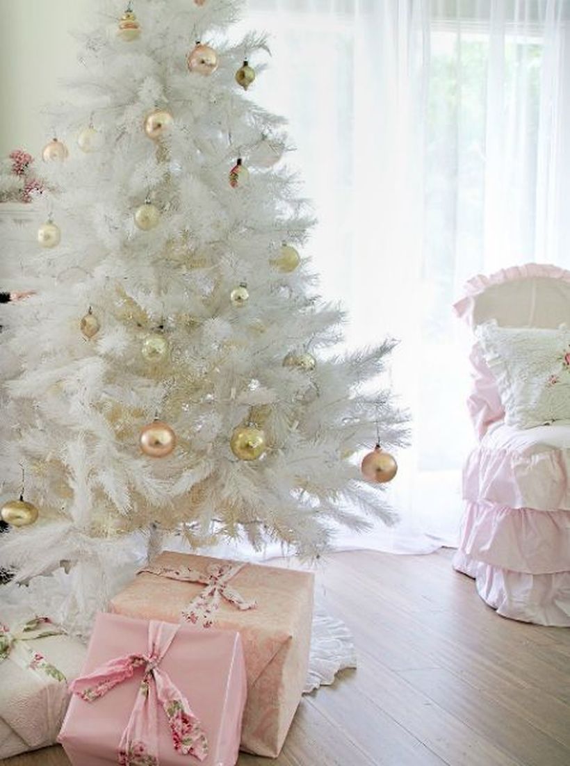 Minimalist-christmas-tree-with-gold-and-copper-bell-ornament-that-adorns-the-pine-tree