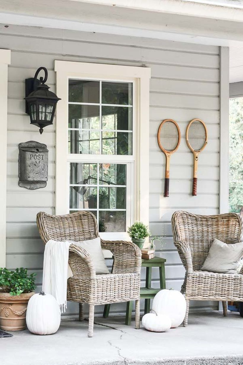 Proch with rattan chairs and white pumpkin