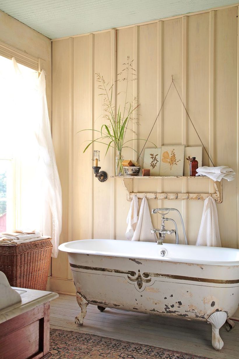 Rustic-bathroom-design-with-hanging-rack-on-the-wall-and-classic-bath-tube-you-must-have