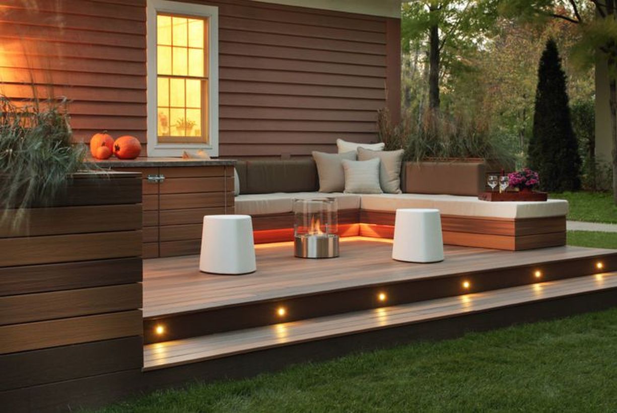 Simple-backyard-patio-deck-with-added-lights-to-the-stairs-and-firing-lights-reflected-to-the-l-shaped-sofa-that-you-can-try