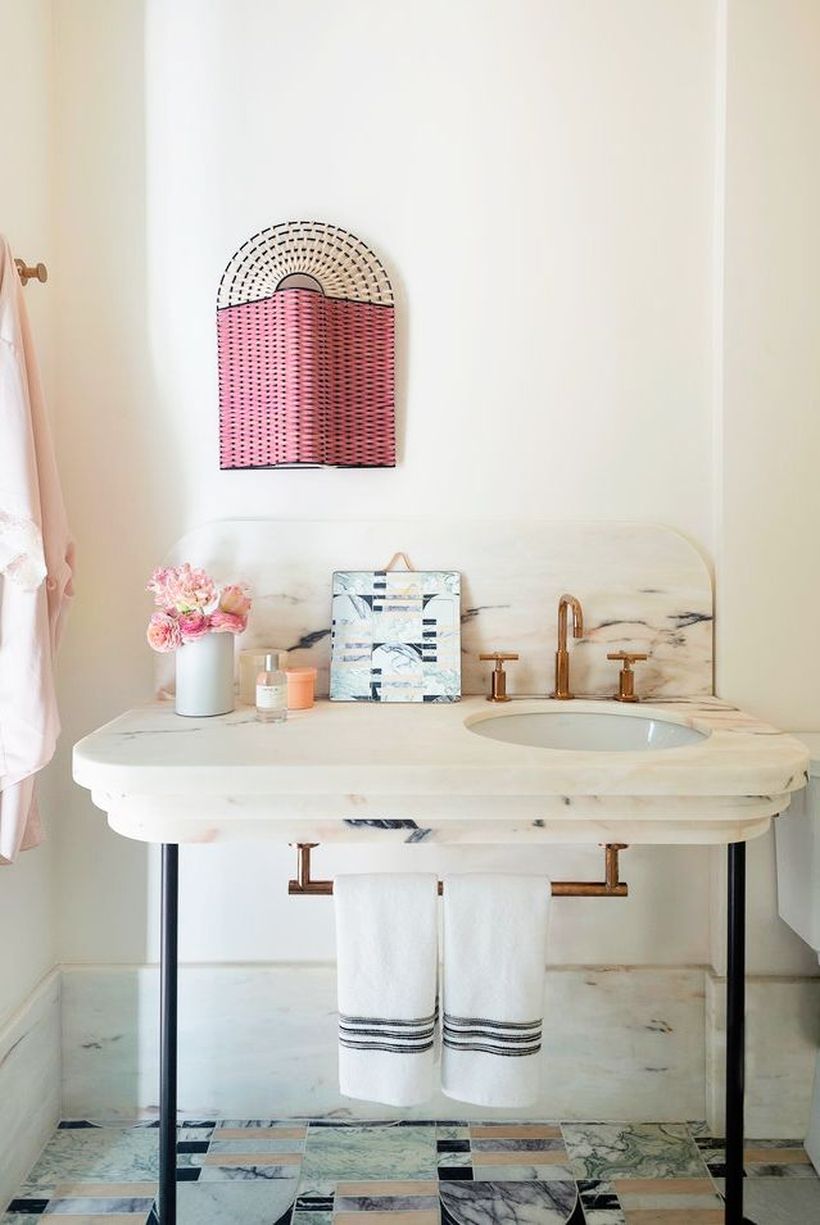 Small-bathroom-design-with-minimalist-granite-table-sink-and-towel-hook-under-the-sink
