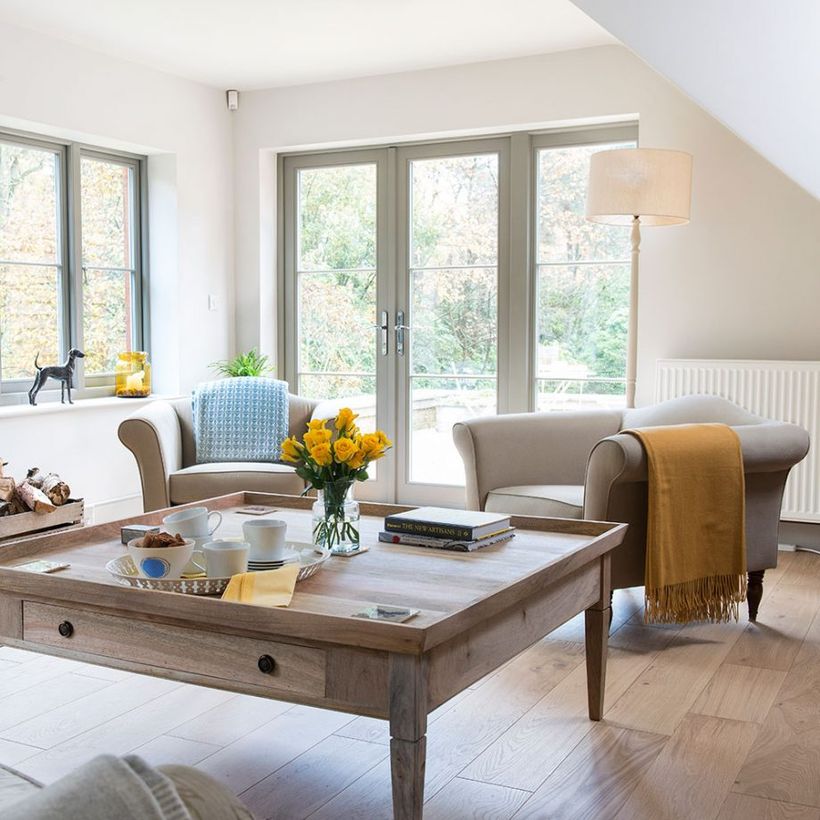 Soft-white-sofa-and-square-wooden-coffee-table-combined-with-wooden-flooring-to-inspire-your-neutral-color-scheme-living-room