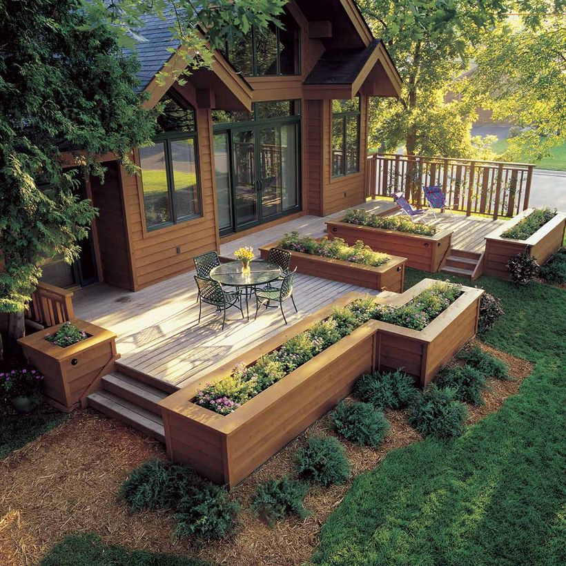 The-black-iron-chair-and-round-coffee-table-topped-with-flower-vases-to-make-it-more-attractive-to-your-patio-deck