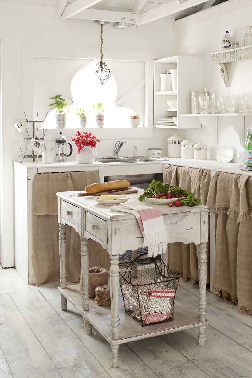Vintage-kitchen-design-with-wooden-kitchen-table-and-white-hanging-rack-to-store-plates-and-glass-cups