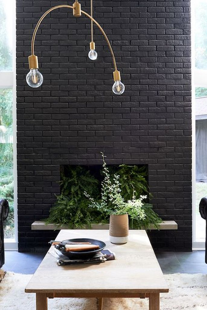 Black brick fireplace combined with greenery