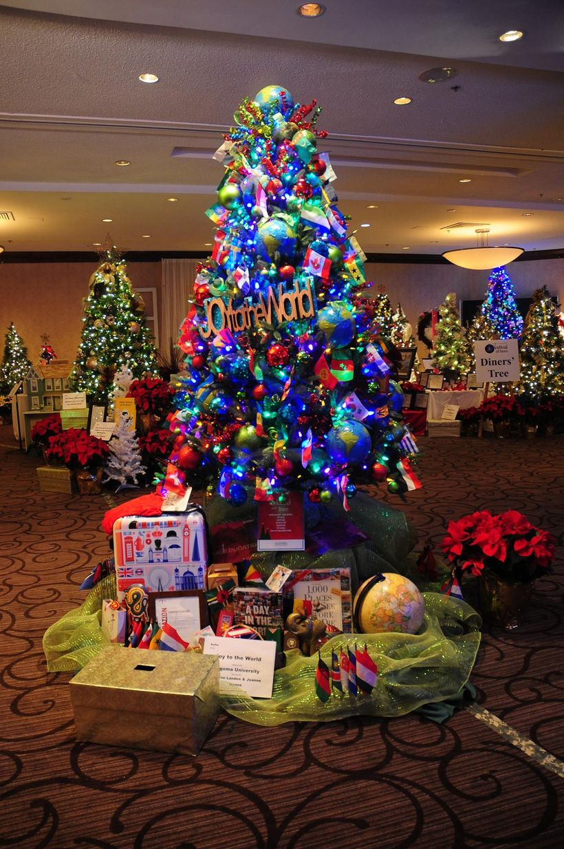 Chrismast tree combine with blue ornament and colorful ribbon