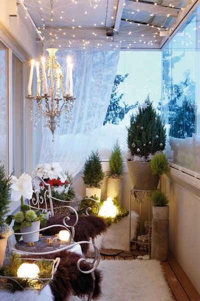 Decorate-the-balcony-with-if-you-have-a-cozy-and-covered-balcony-decorate-with-tiny-christmas-tree.-you-can-even-enhance-the-decoration-with-a-candle-chandelier.