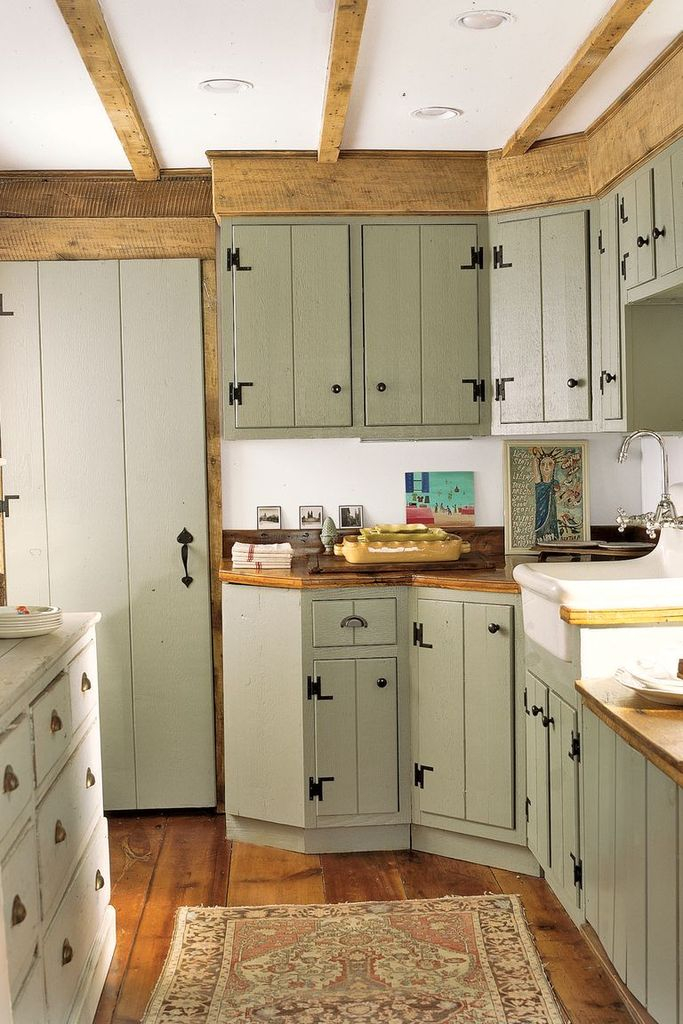 Farmhouse kitchen with green cabinets