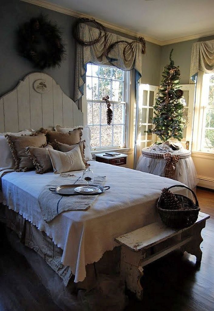 Farmhouse bedroom with christmas tree at the corner