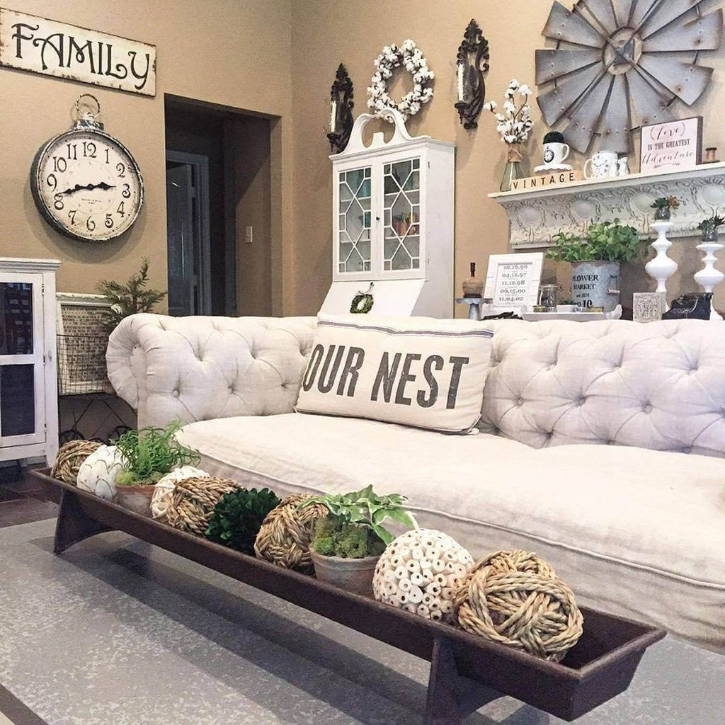 Farmhouse living room decoration with ball in rope material combined with white wreath and old windmill on the wall to perfect your living room