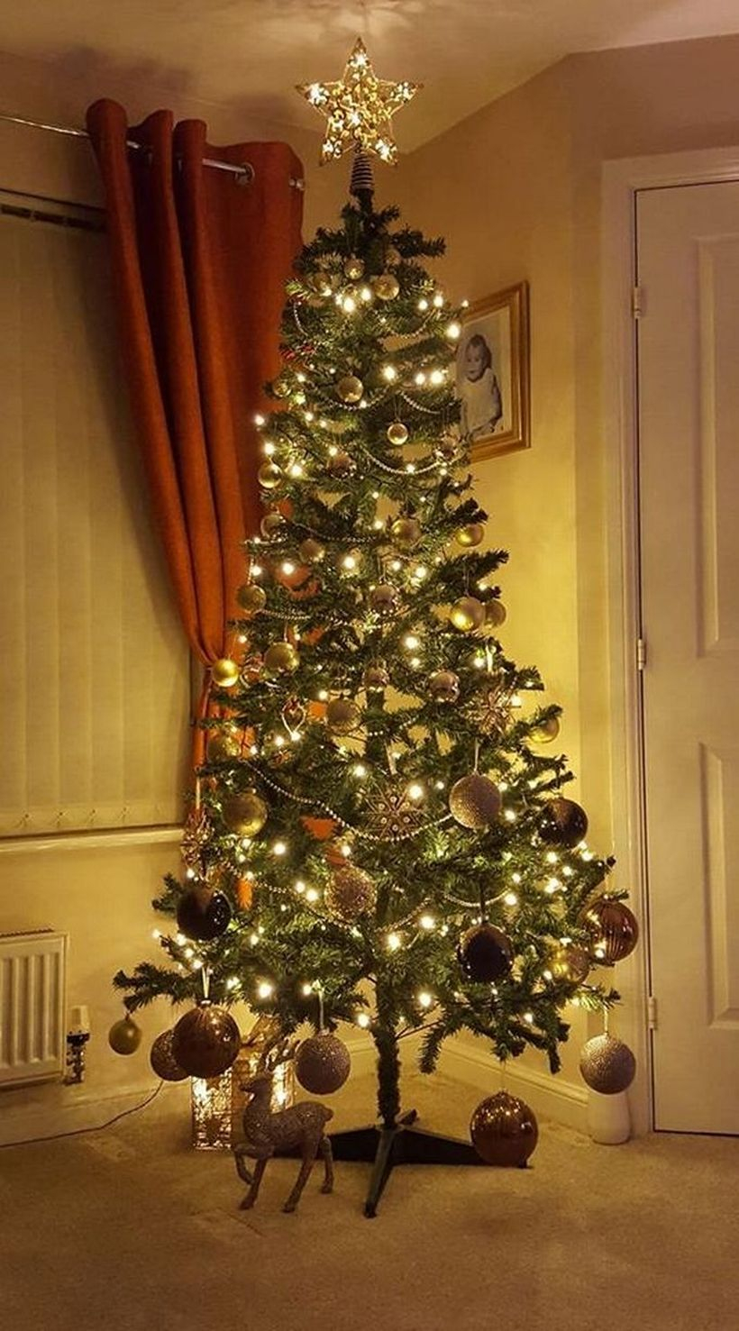 Green chrismast tree with gray ornament and yellow light ideas