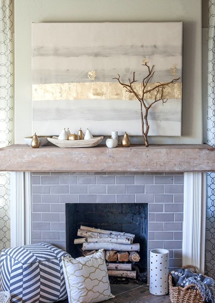 Grey brick fireplace combined with branch above it