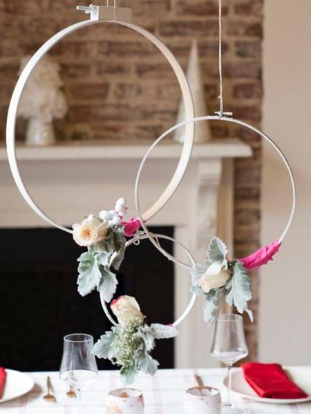 Hanging-wreaths-studded-with-a-few-seasonal-florals.