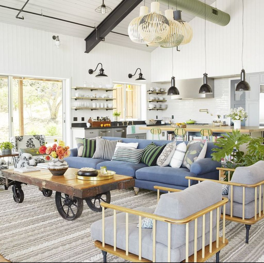 Modern farmhouse living room with blue sofa and unique table to complete your living room