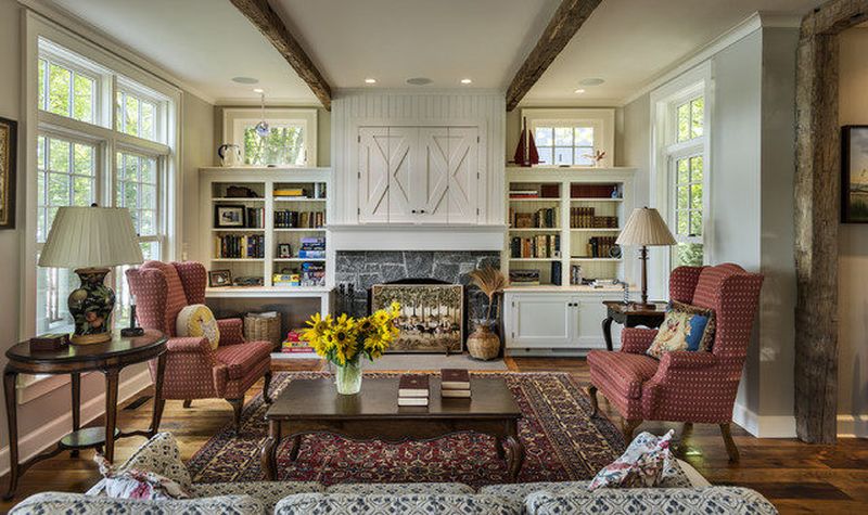 Rustic-armchairs-living-room-farmhouse-built-in-bookshelf-and-built-in-bookshelf-beige-beadboard-molding-trim-wall-built-in-bookcase-bookshelf-cabinets-dark-w