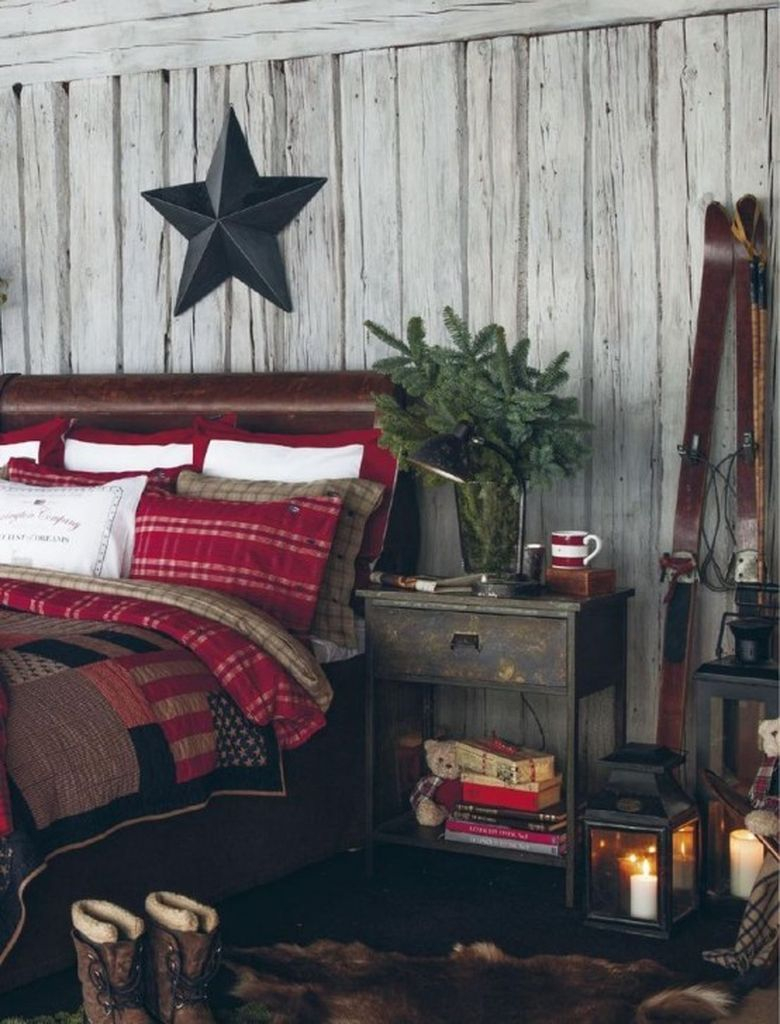 Rustic bedroom with a faux fur rug, an evergreen arrangement