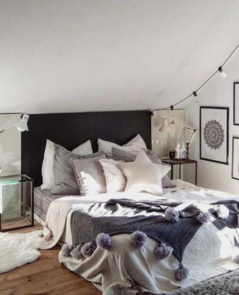 Small bedroom with string lamps