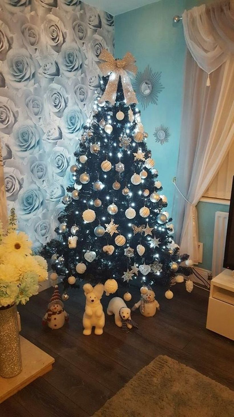 Small green chrismast tree with white ornament