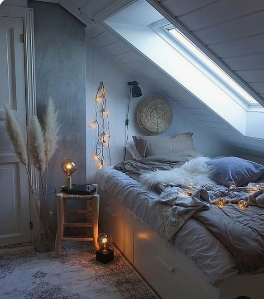 Small loft bedroom with simple decorative lighting