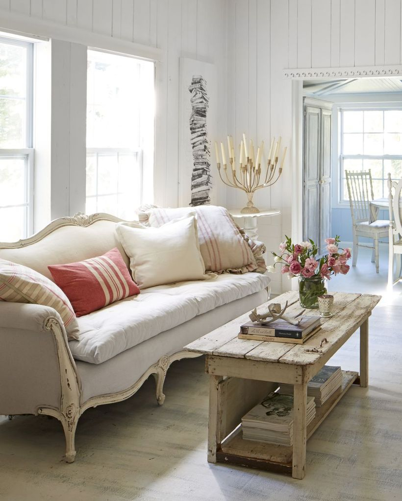 Stripped white and red cushion with white sofa