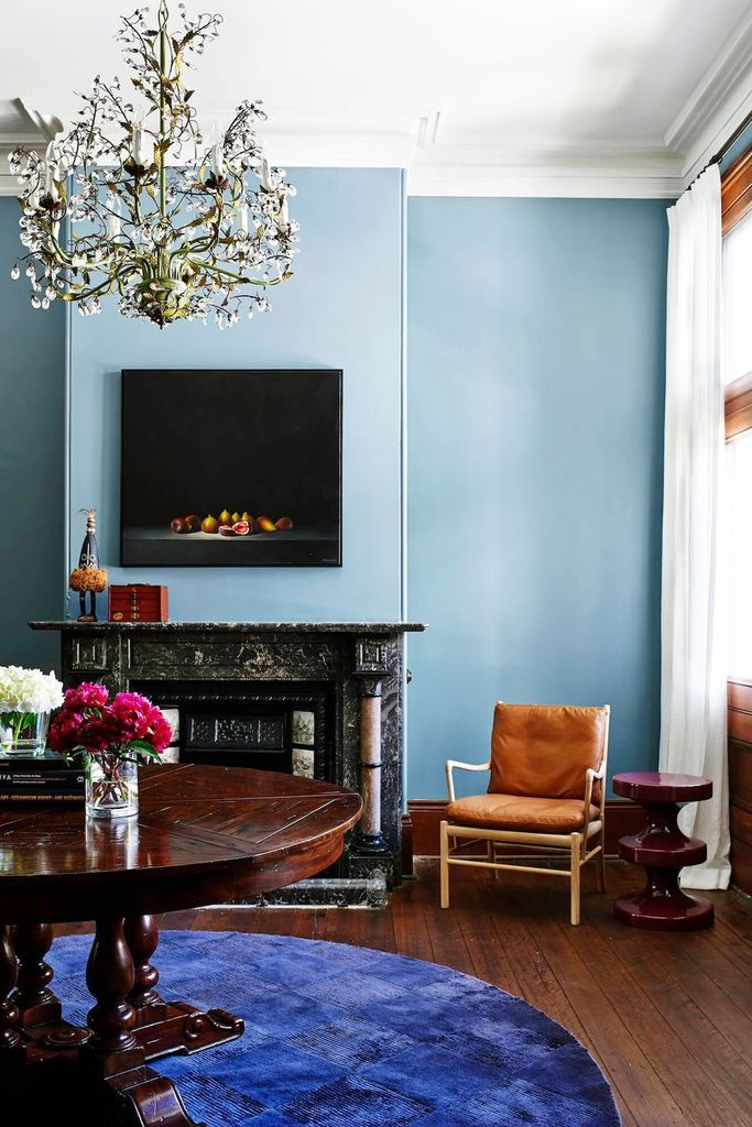 Unique fireplace combined with blue walls
