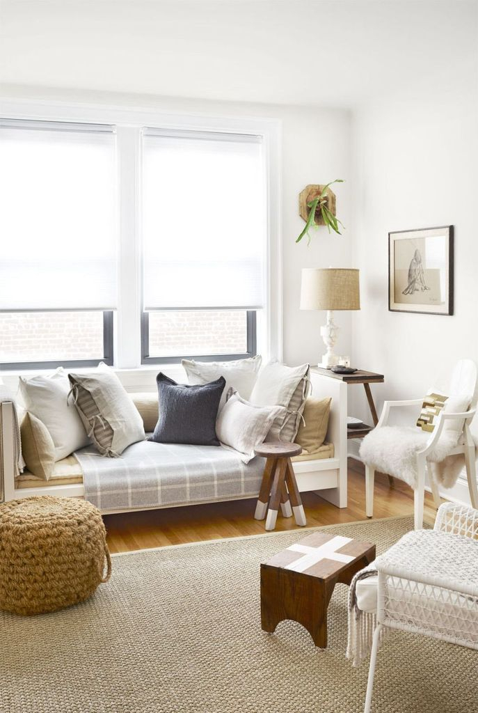 White chair and small wooden coffee tables combined with a table lamp to make more a classy your farmhouse living room design