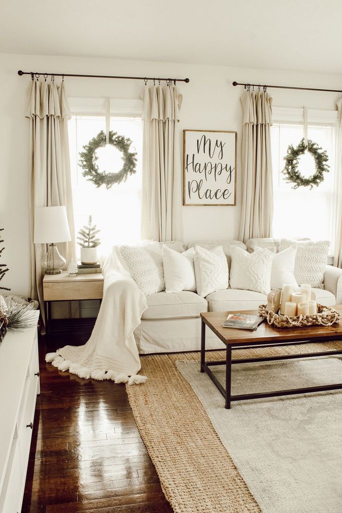 White-farmhouse-living-room-with-hanging-wreath-on-the-window-to-perfect-your-living-room