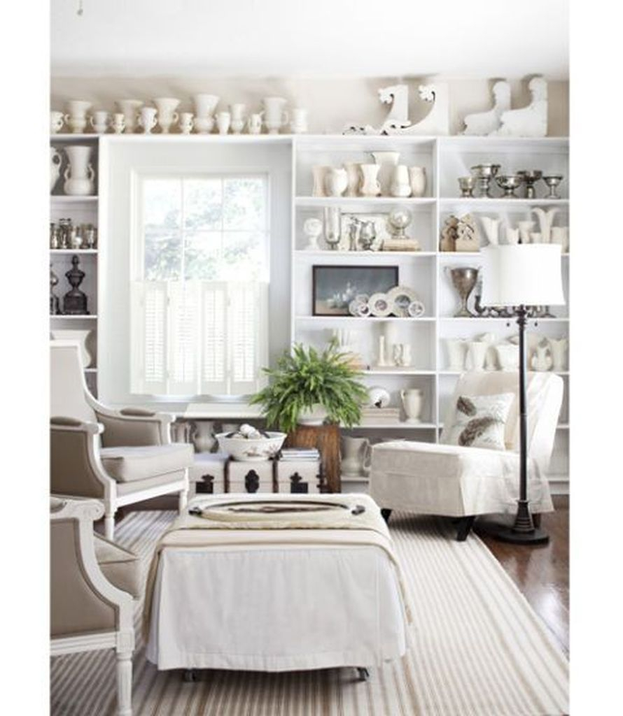 White walls combined with white shelves for living room