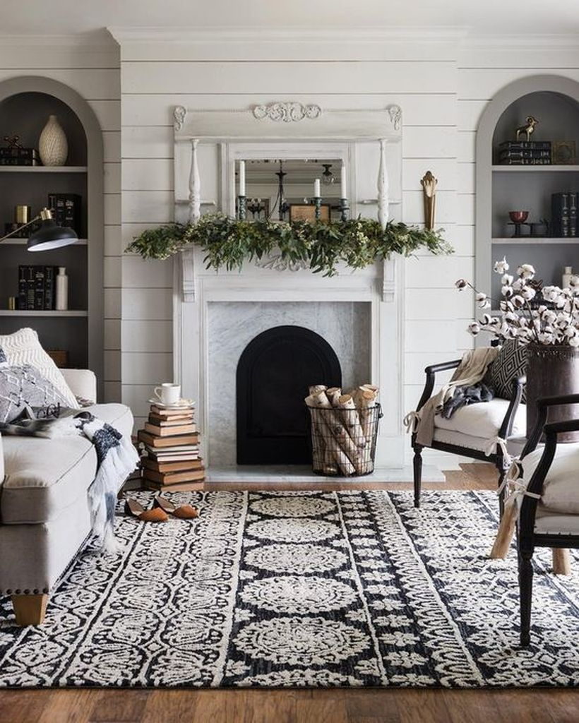 Winter fireplace with greenery and candle holder