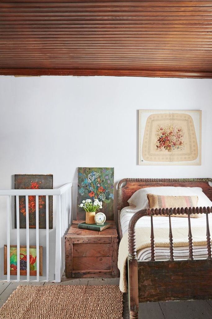 An antique wooden bed for farmhouse bedroom